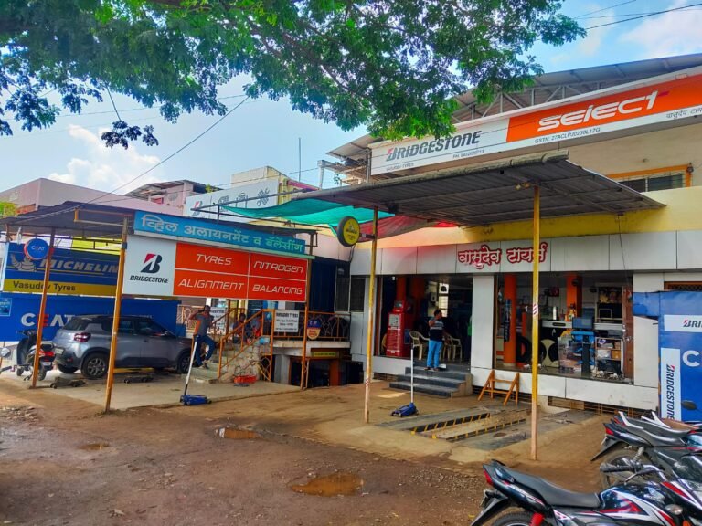 Shop front canopy over a tyre showroom, seen from the road